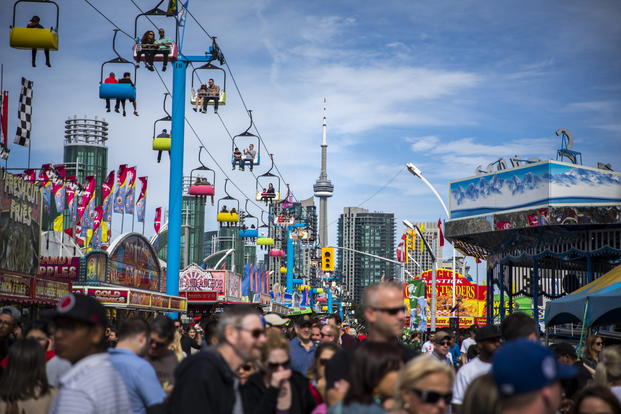 Image of the Toronto skyline and CNE midway during the day.