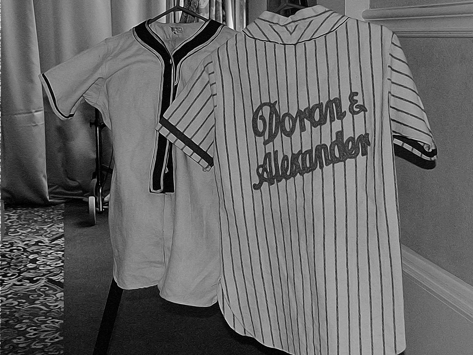 two old baseball shirts in black and white