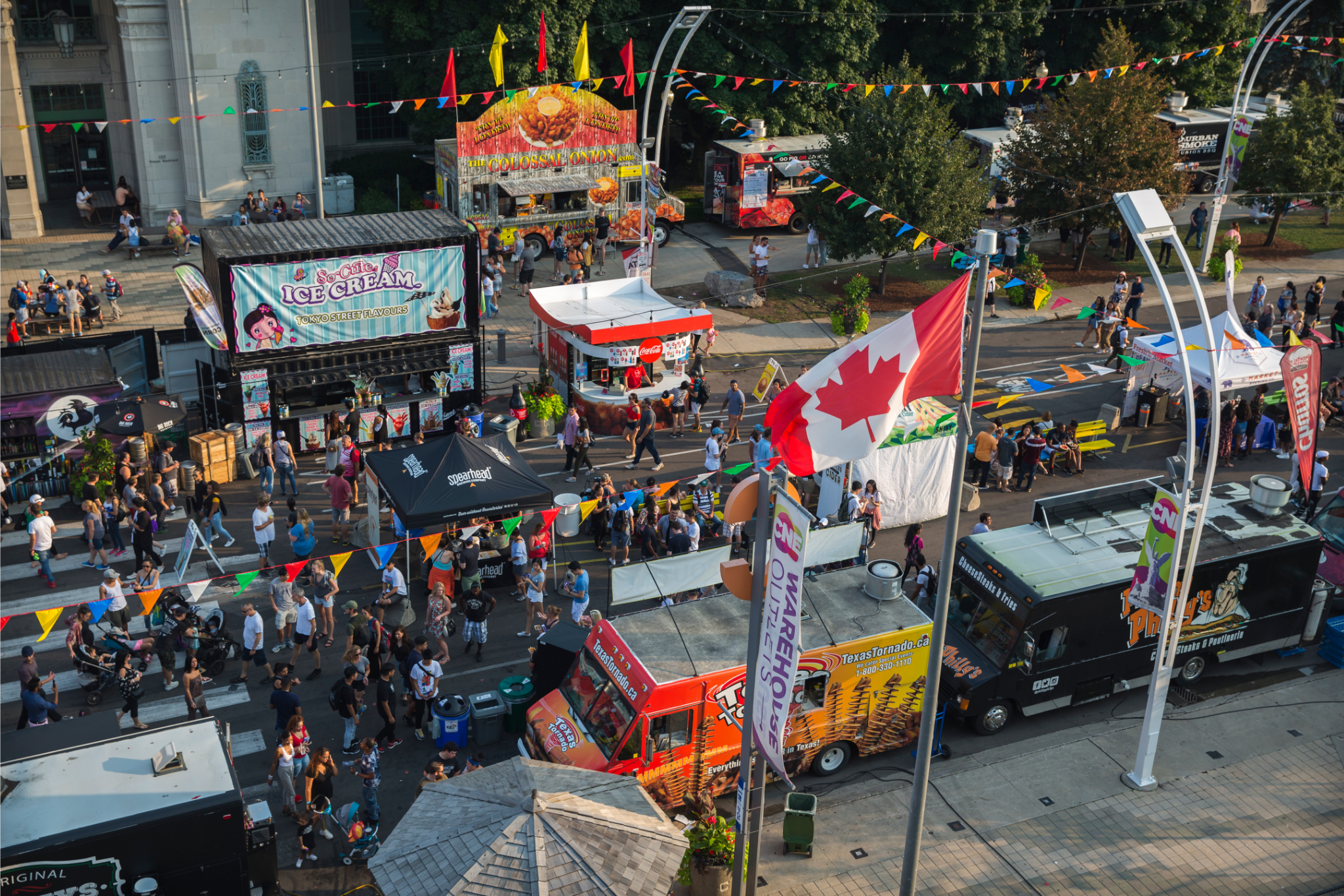 Food Truck Frenzy and Craft Beerfest. Aerial image looking down at the food trucks, people walking around and ordeing food.