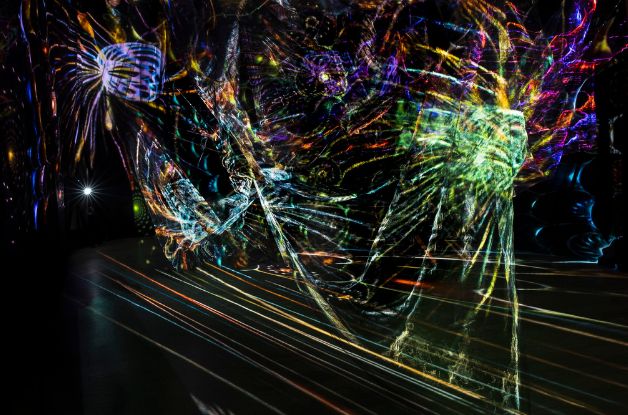 A photo of light projections inside the A Trip through 103: Therapy for the Soul exhibit