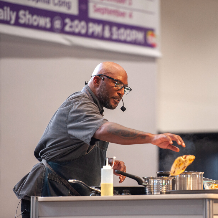 Chef Robert Rainfort cooking on the Kitchen Stage